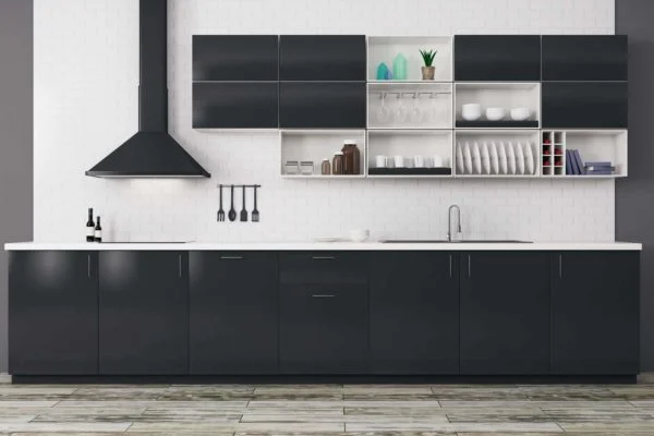 Modern kitchen design with dark lower cabinets, white countertops, a black range hood, and open upper shelves displaying dishes, glasses, and decor items. The tiled floor and wall-hung utensils reflect popular 2021 kitchen design trends. Modern kitchen design with dark lower cabinets, white countertops, a black range hood, and open upper shelves displaying dishes, glasses, and decor items. The tiled floor and wall-hung utensils reflect popular 2021 kitchen design trends.