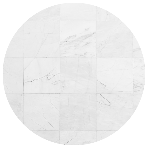 A circular arrangement of white marble tiles with faint gray veins and subtle cracks, forming a seamless patterned surface—perfect for elevating any kitchen remodel. A circular arrangement of white marble tiles with faint gray veins and subtle cracks, forming a seamless patterned surface—perfect for elevating any kitchen remodel.