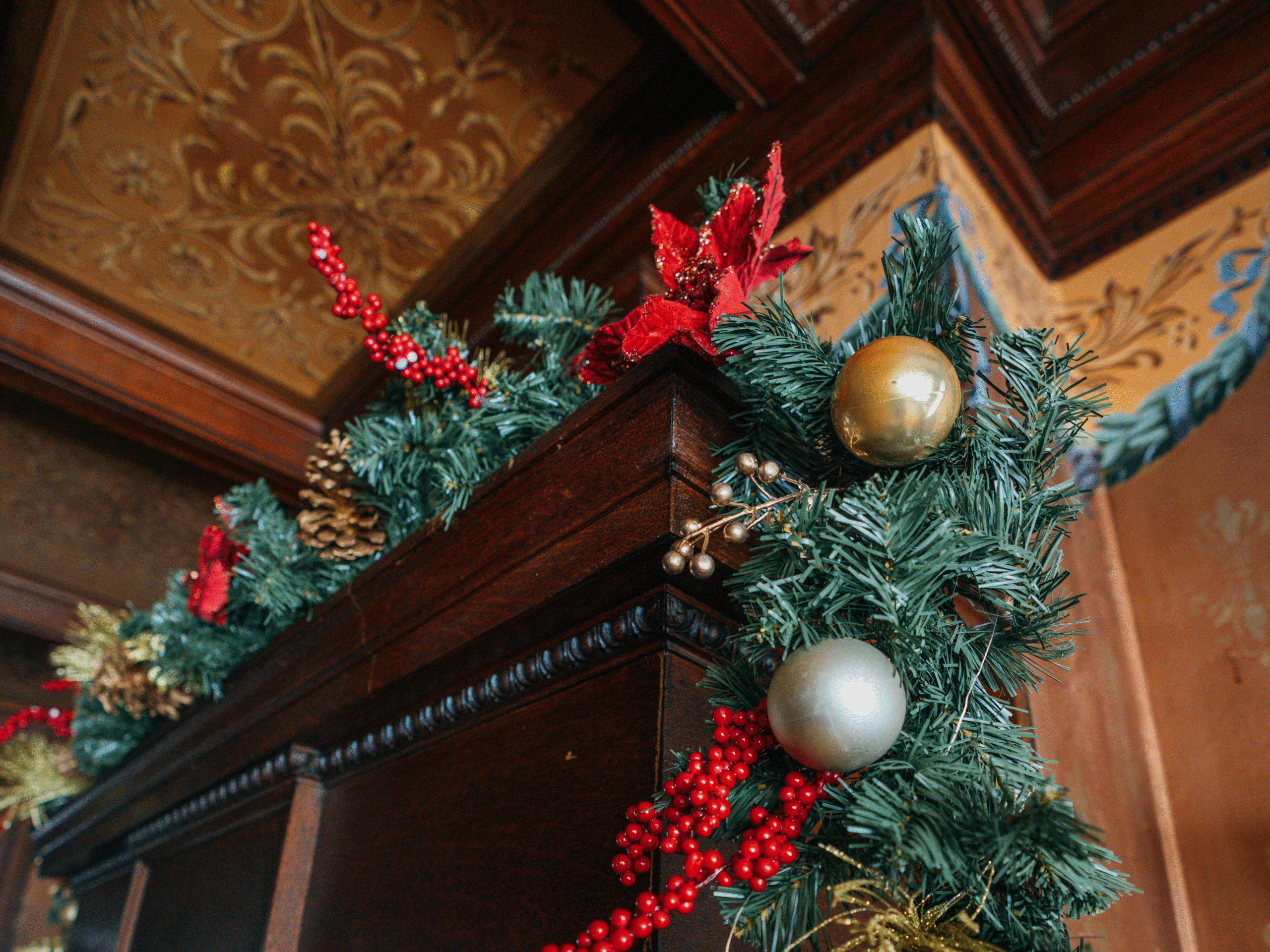 Ceiling with decorative elements and lighting. Ornate interior design