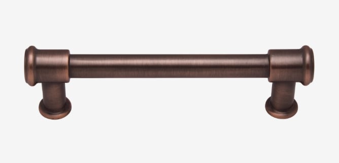 Brown cabinet handle on white background. Bronze hardware.