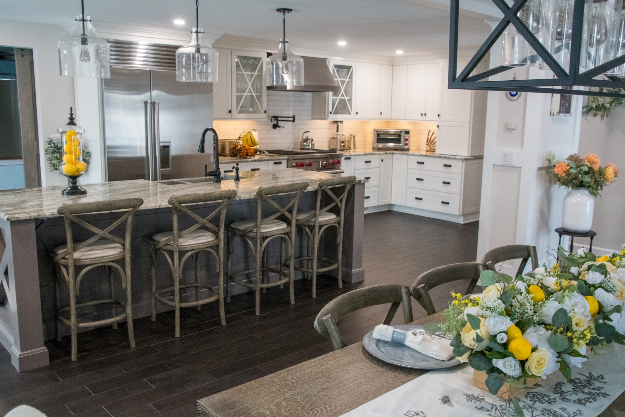 Beautiful kitchen interior with island and dining table