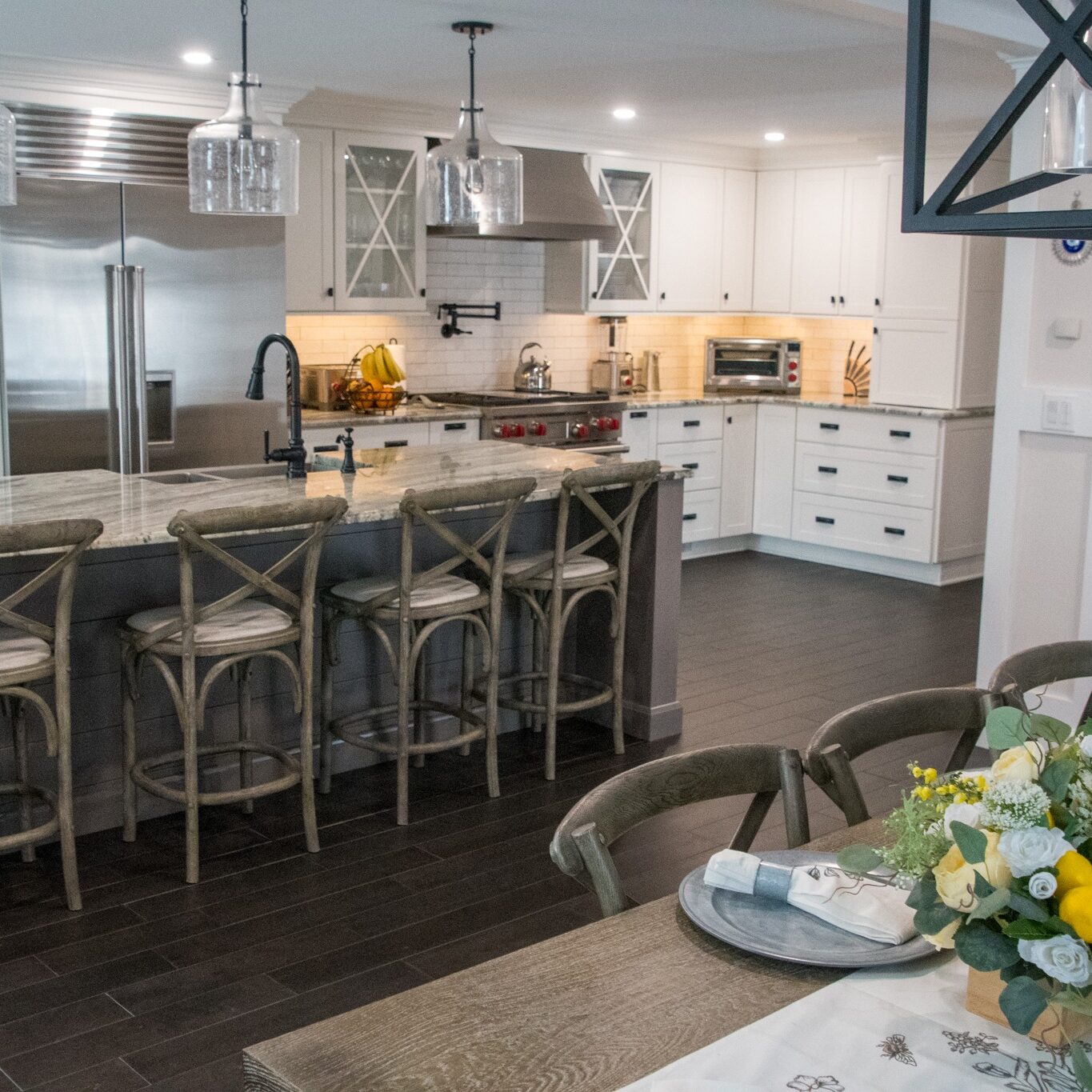Beautiful kitchen interior with island and dining table